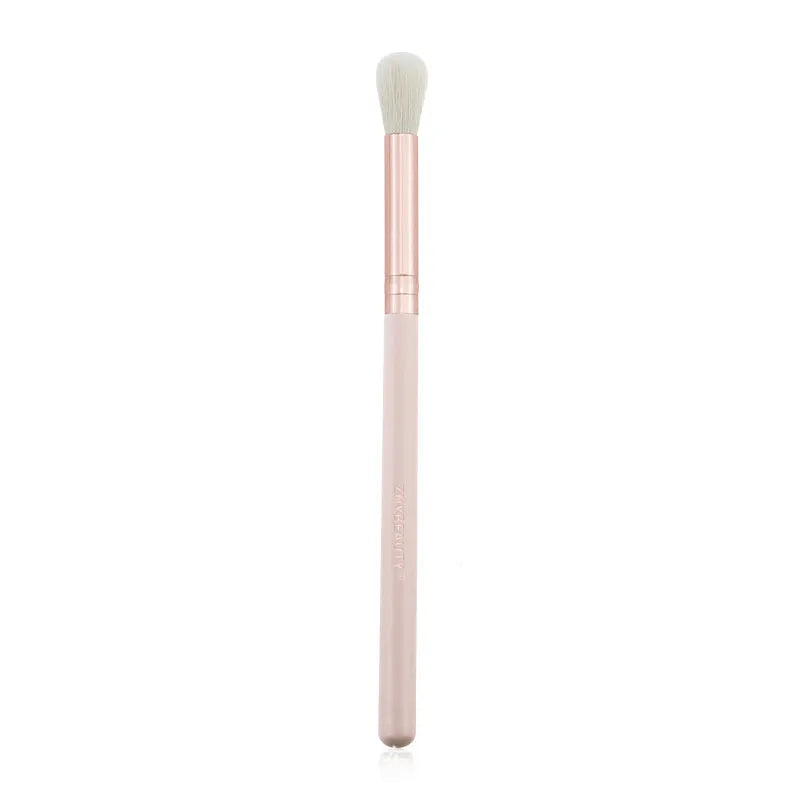 26 pink makeup brushes with wood handles arranged in a PU travel pouch.