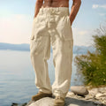 Man wearing light army green loose cotton wide-leg casual trousers with a mid waist.