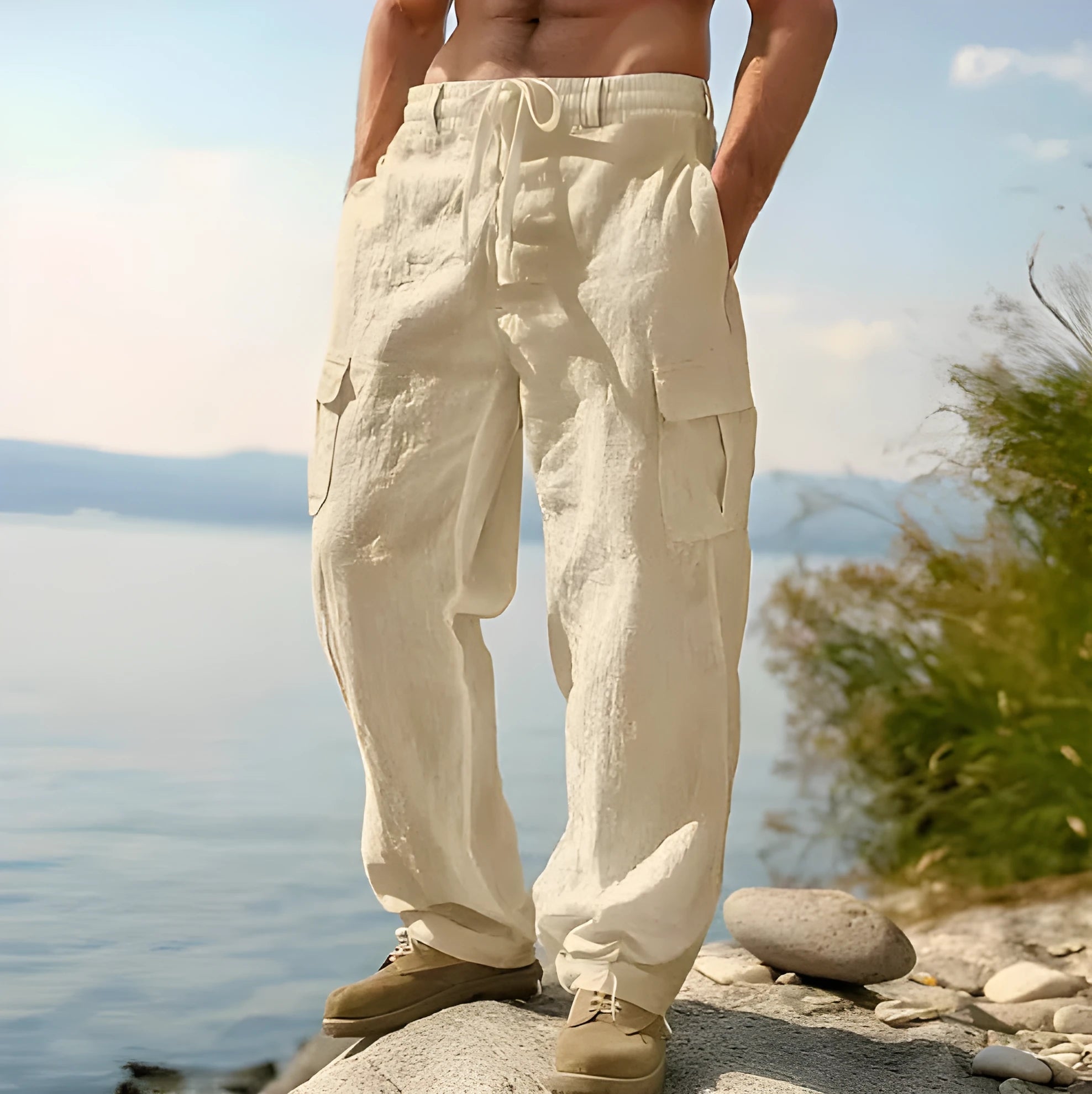 Man wearing light army green loose cotton wide-leg casual trousers with a mid waist.