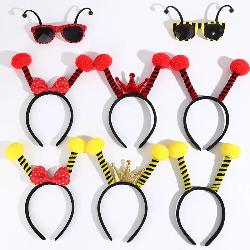 Yellow children's costume headband and glasses set with bee, butterfly, and ladybug patterns.