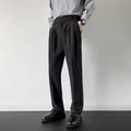 Men's straight-leg loose fit suit trousers in apricot colour on a hanger.