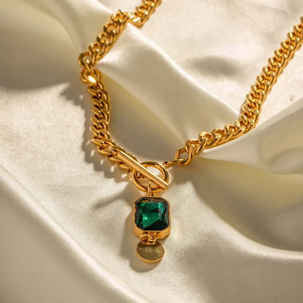 Gold electroplated titanium steel necklace with emerald zircon pendant and Cuban link chain