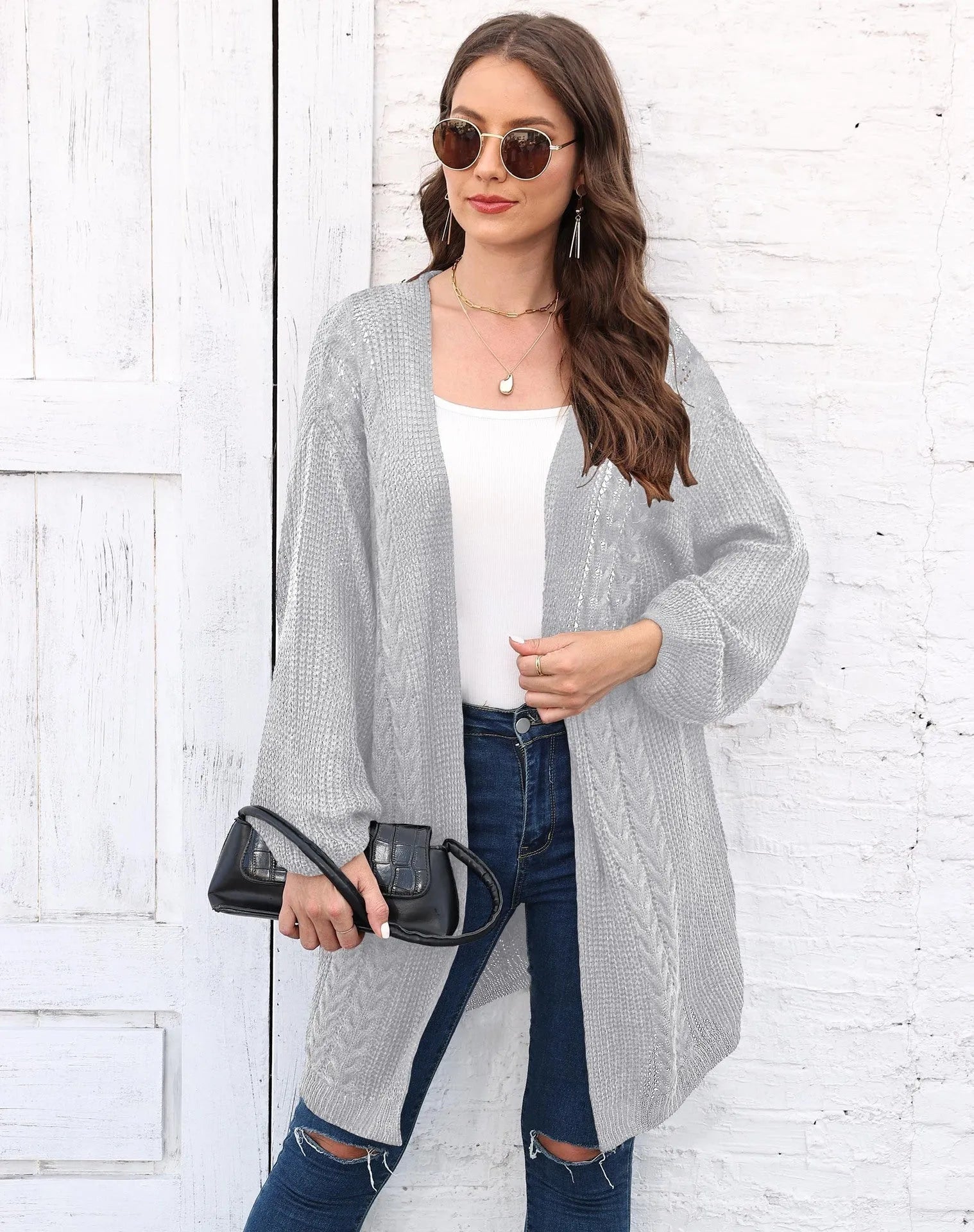 Women's loose acrylic sweater coat in army green, shown as a layering piece.