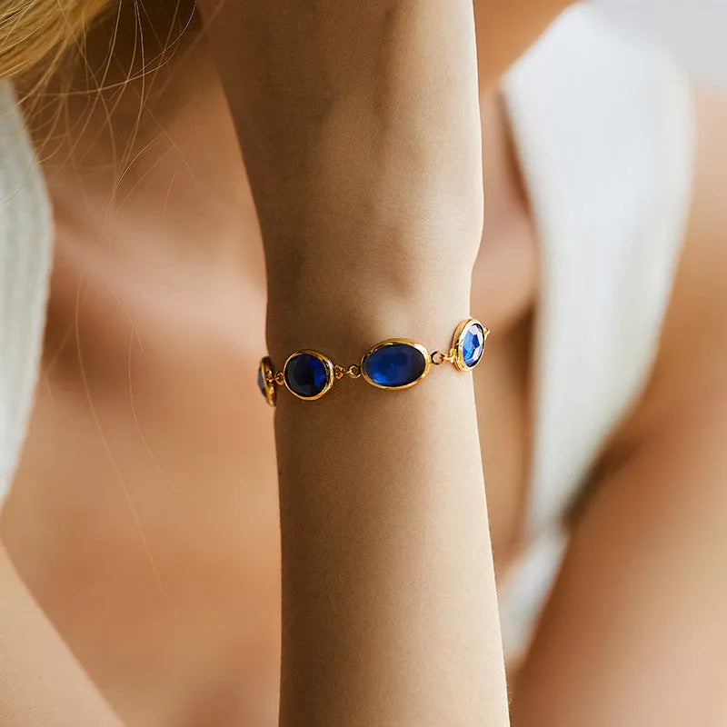 Women's geometric bracelet with blue glass inlay on a copper band.