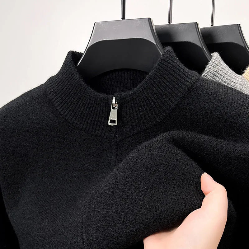 Men's black zip-up knitted cardigan with a stand collar on a hanger