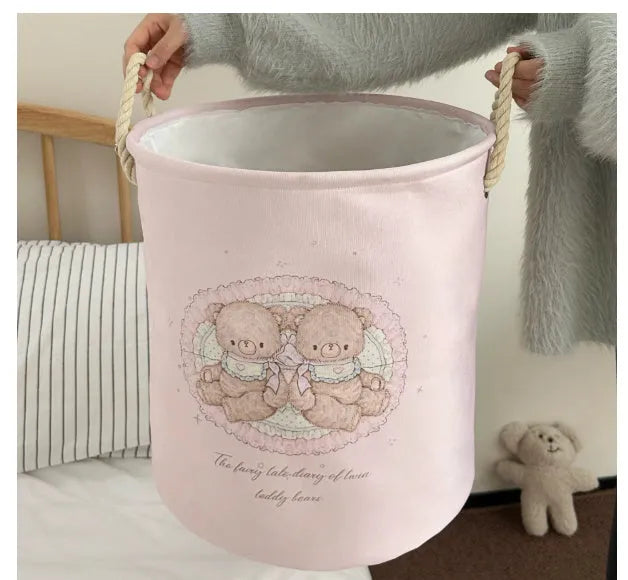Foldable cotton laundry basket in a colourful design, shown unfolded for use.