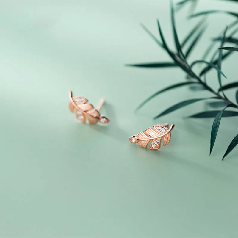 Copper willow leaf stud earrings with micro-inlaid leaf detail and geometric Mori style in rose gold and white gold colour