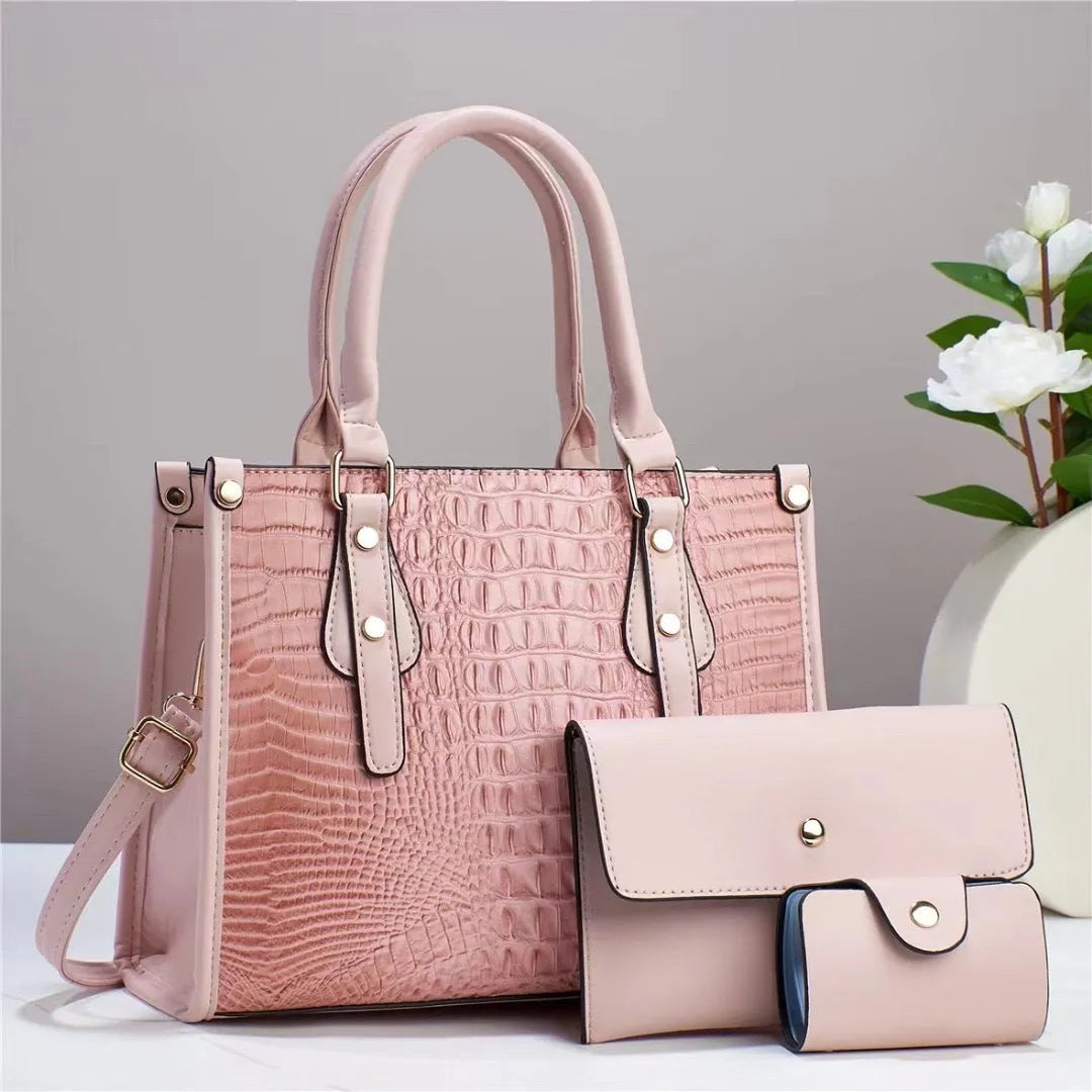 Minimalist textured PU three-piece bag set showing crossbody bag, wallet, and card holder in a contrast colour.