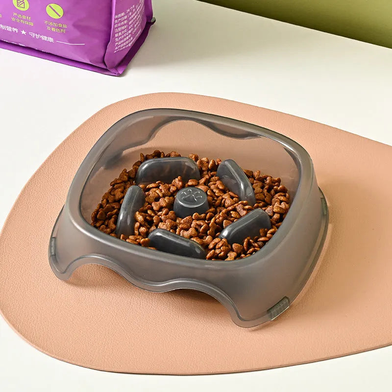 Blue plastic dog slow feeder bowl with anti-choking design on white background