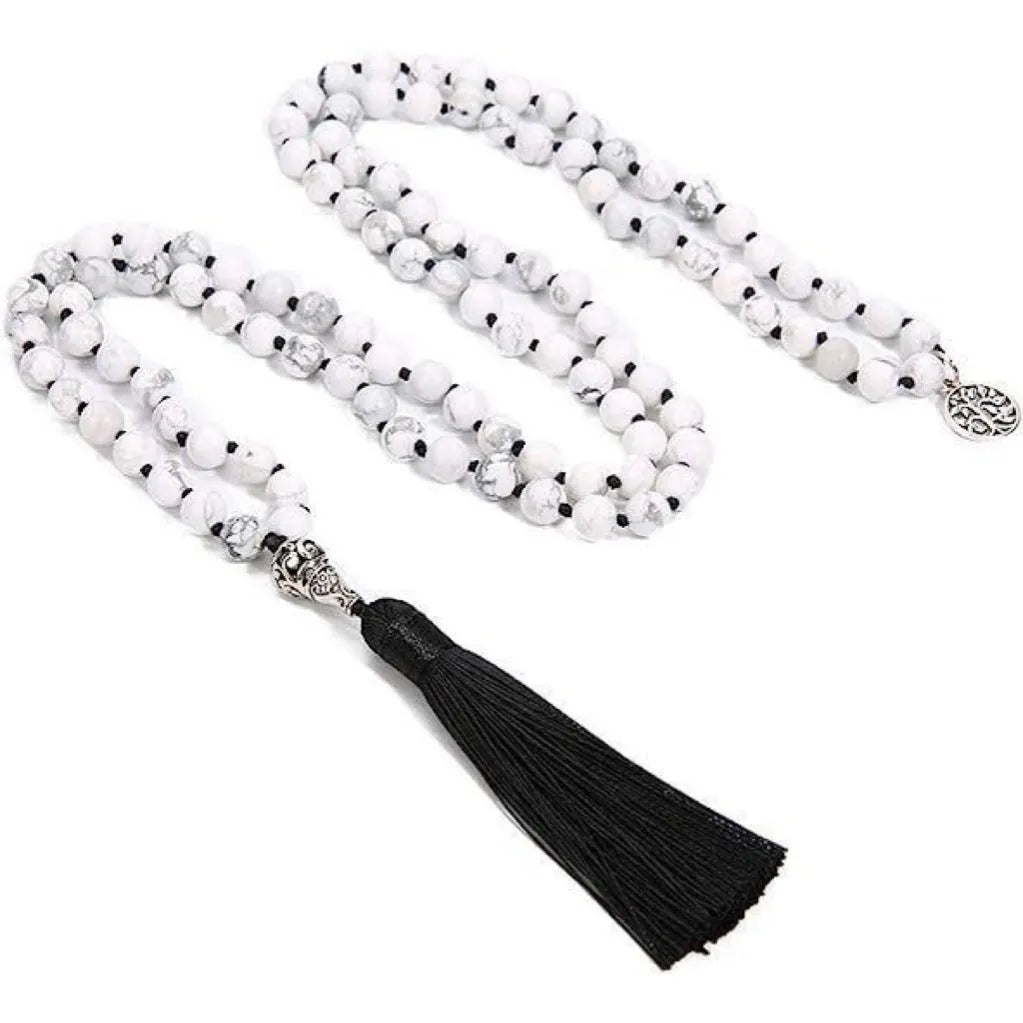 Handmade knotted beaded necklace with stone pendant showing 108 beads and geometric design