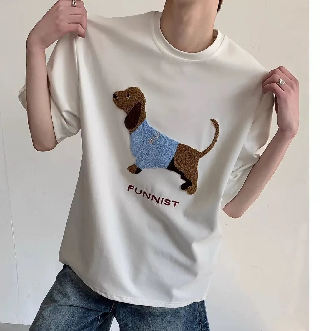 Grey men's T-shirt with a raised towel embroidery sausage dog design on the chest.