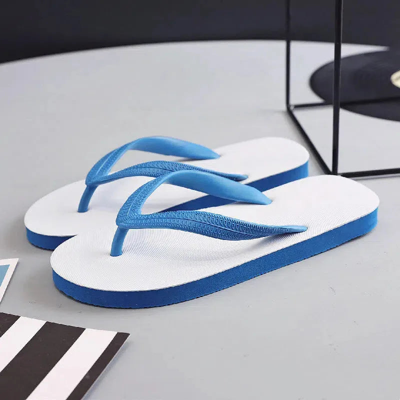 Fish label rubber beach flip-flops in green, red, blue, or black, showing non-slip sole.