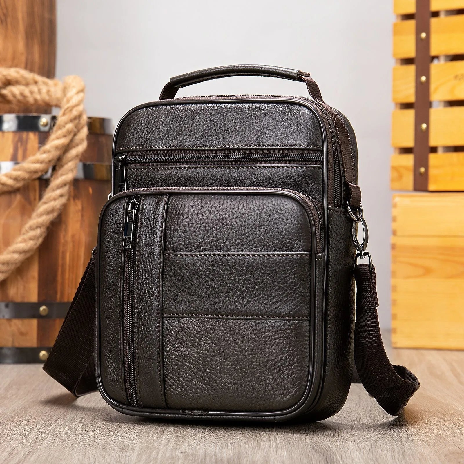 Vintage style genuine leather men's shoulder bag in vertical square shape showing internal organiser pockets