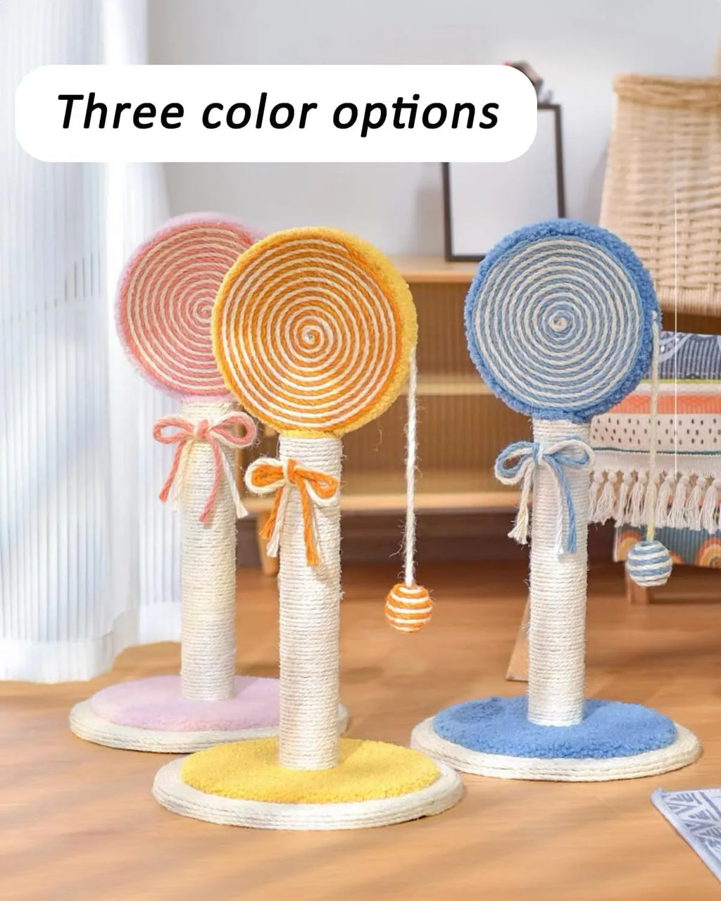 Cat scratching post with sisal rope surface and hanging ball toy on sturdy wood base