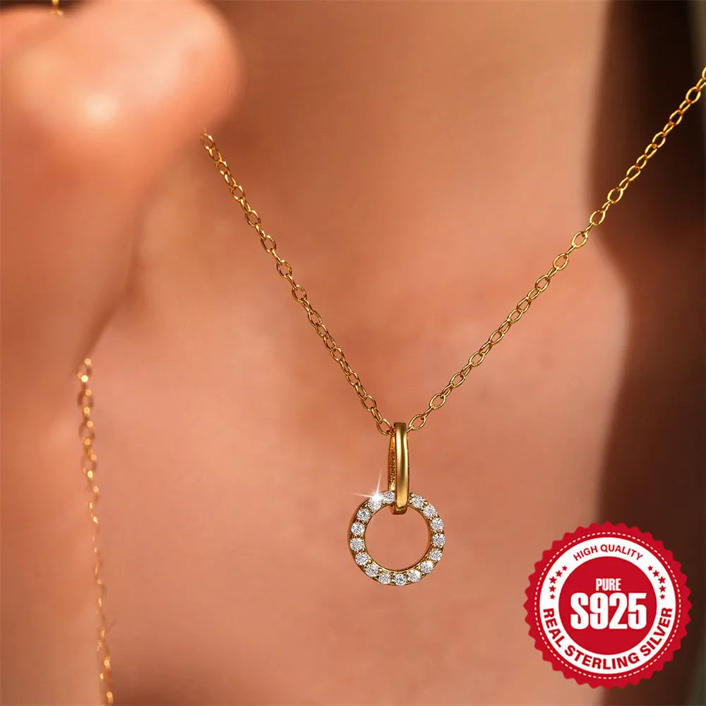Gold-colour sterling silver necklace with geometric zircon pendant on an adjustable clavicle chain.