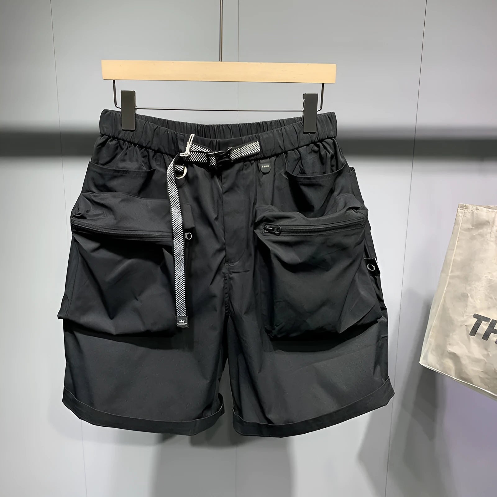 Men's loose fit work shorts in black or grey with pockets and non-iron treatment