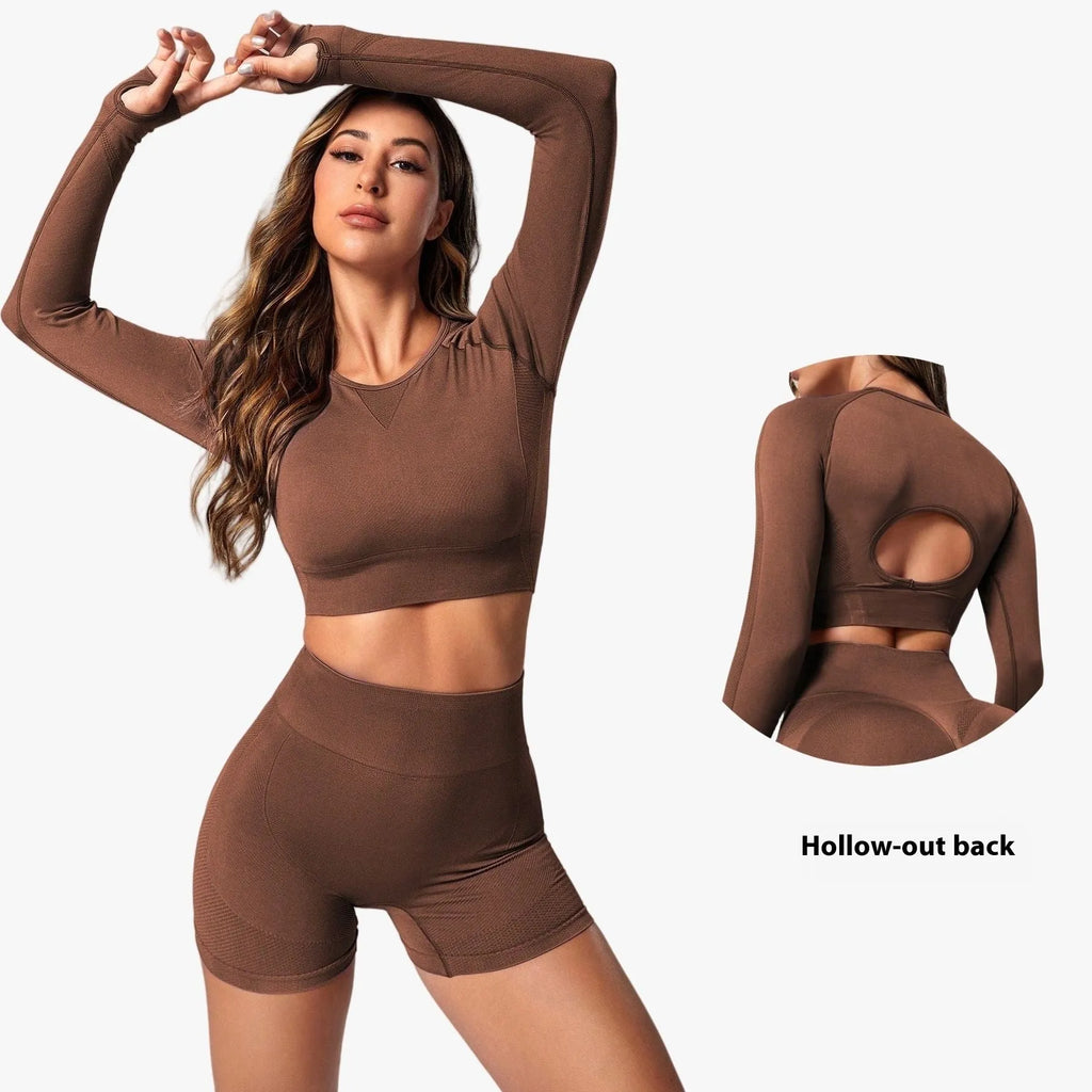 Women's yoga suit set in black colour showing high-waist pants and long sleeve pullover top