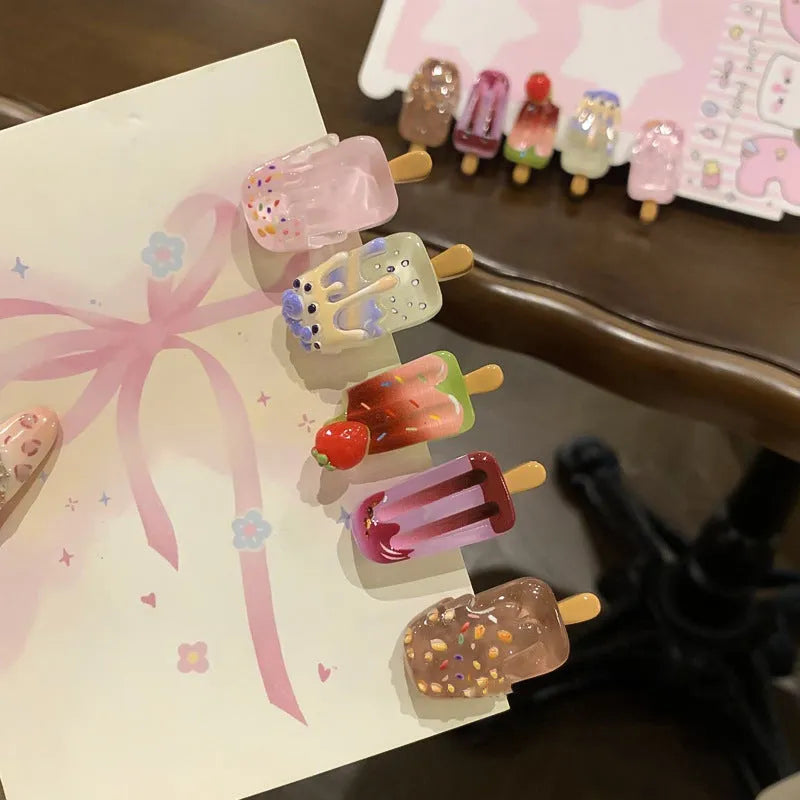 Resin hair barrette featuring a cartoon ice cream design in pink, red, coffee, purple, and beige colour options.