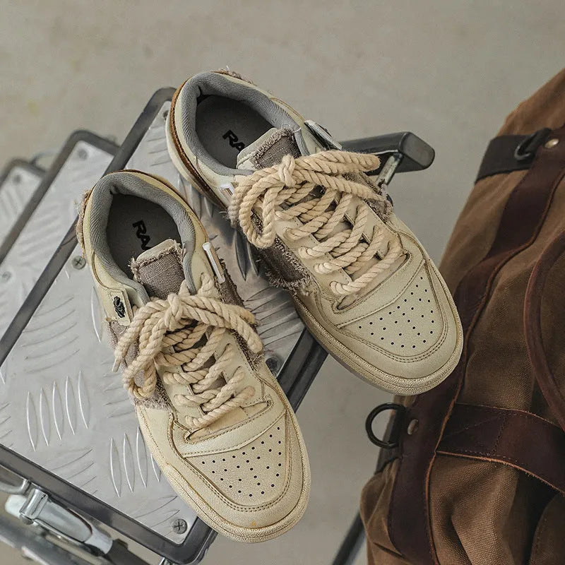 Beige microfiber skateboard shoes with flat rubber sole and lace-up closure