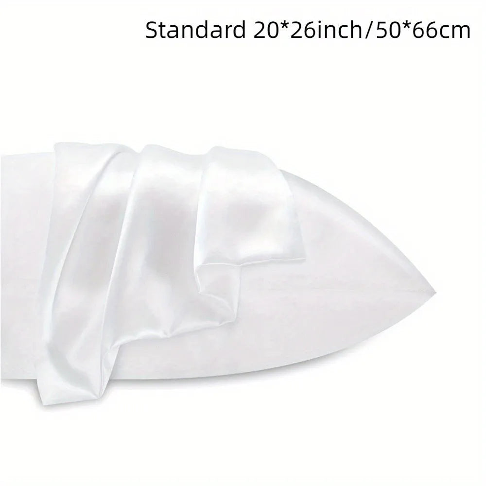 A pair of solid colour satin pillowcases in a chosen shade, showing the smooth plain weave fabric texture.