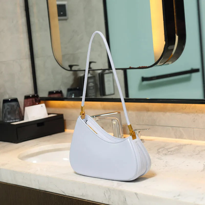Women's oval retro underarm bag in PU leather with single strap and sewing line detailing