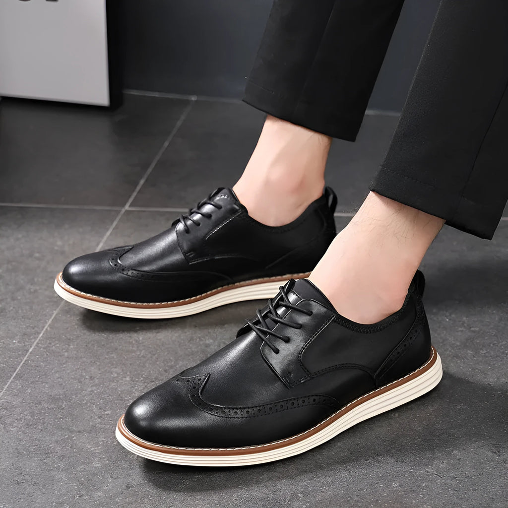 Men's black slip-on casual shoe with round toe and carved TPR sole for business wear.