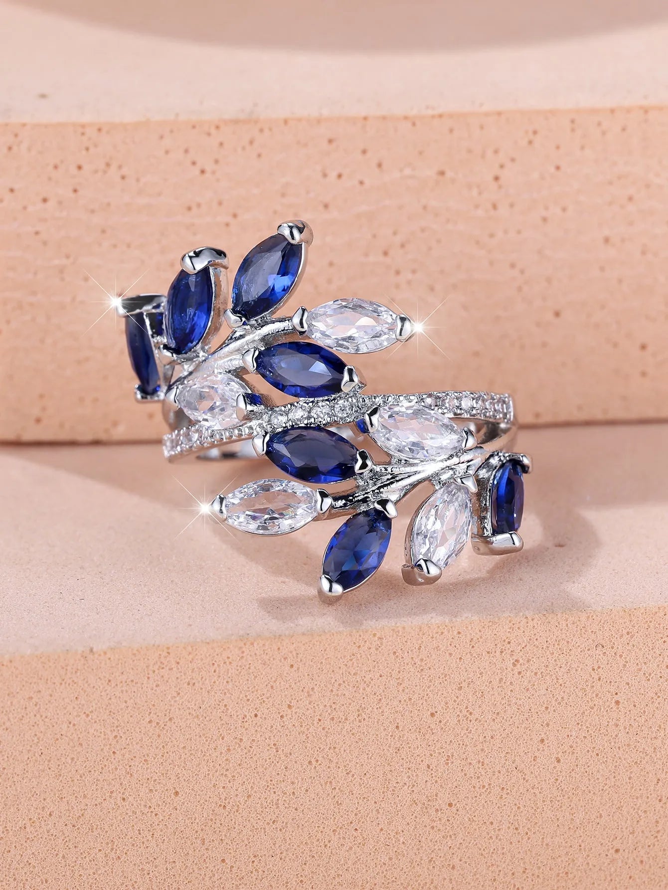 Adjustable copper leaf ring with a horse eye zircon stone in a choice of nine colour finishes.