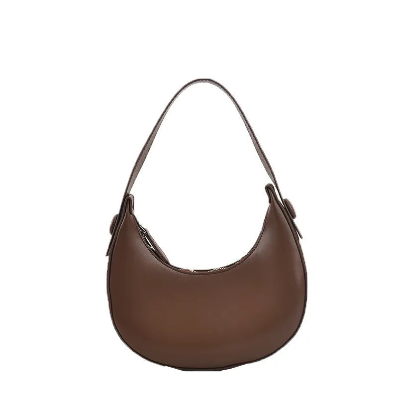 Women's cream yellow retro dumpling-shaped PU leather shoulder bag showing front and internal zippered pocket.