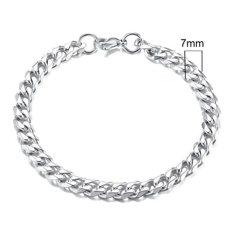 Six-sided geometric Cuban link metal bracelet in gold, black, and steel colour finishes.