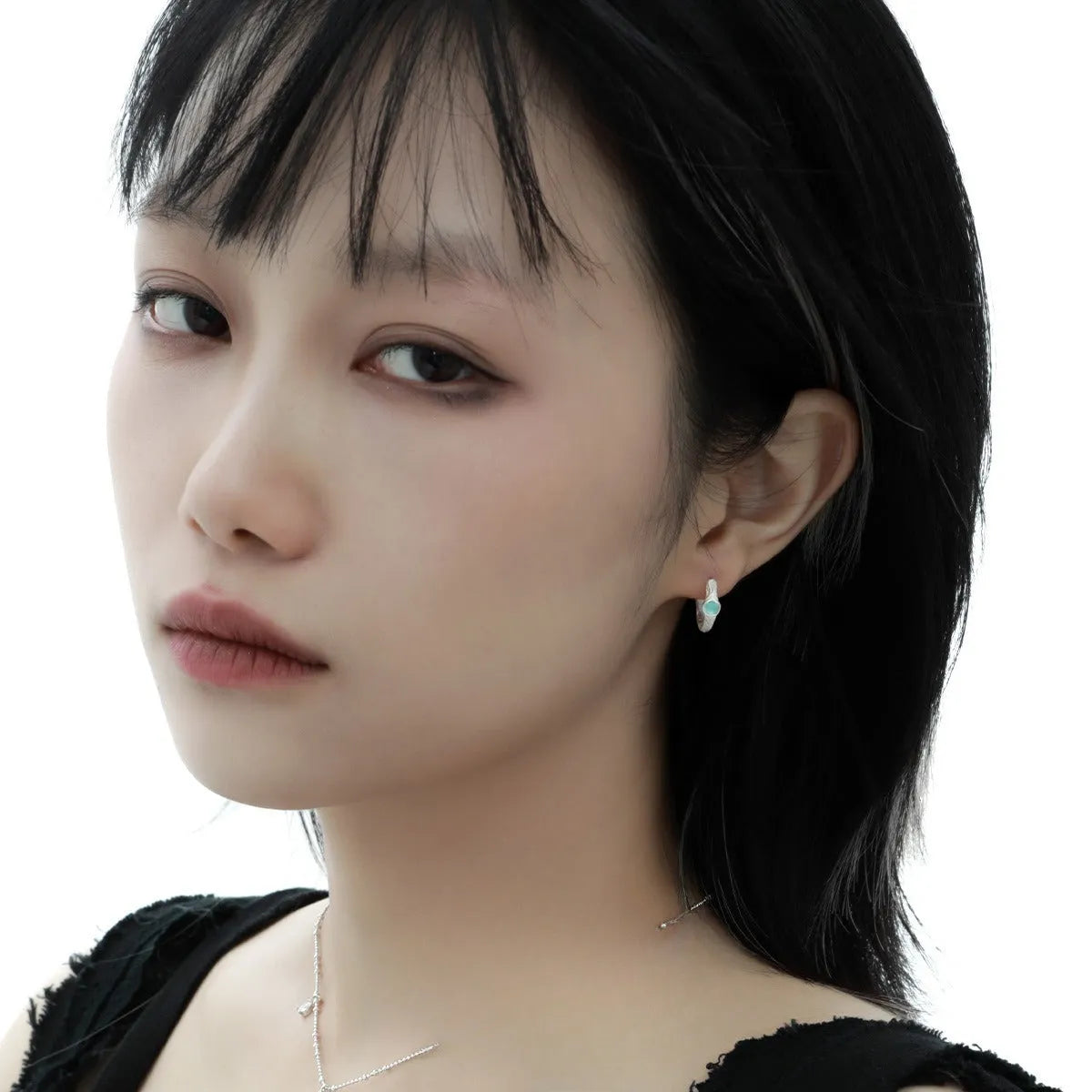 Geometric round ear clip in burnt silver tone, made from 925 silver with a clip-on back.