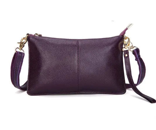 Structured cowhide leather lady slant bag showing front zipper compartment and dual strap options