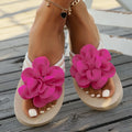 Plus size floral slipper in solid colour with round toe and flip flop style.