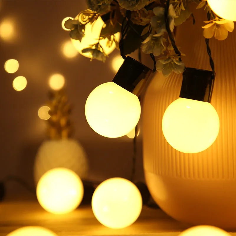 Solar-powered retro decorative string lights for festival tents with black wiring and LED lamps