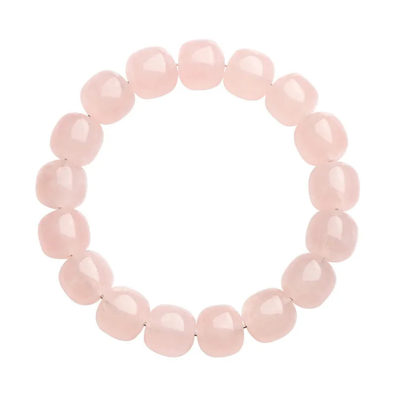 Pink bamboo crystal barrel bead bracelet with geometric 11mm-12mm beads on a wrist.