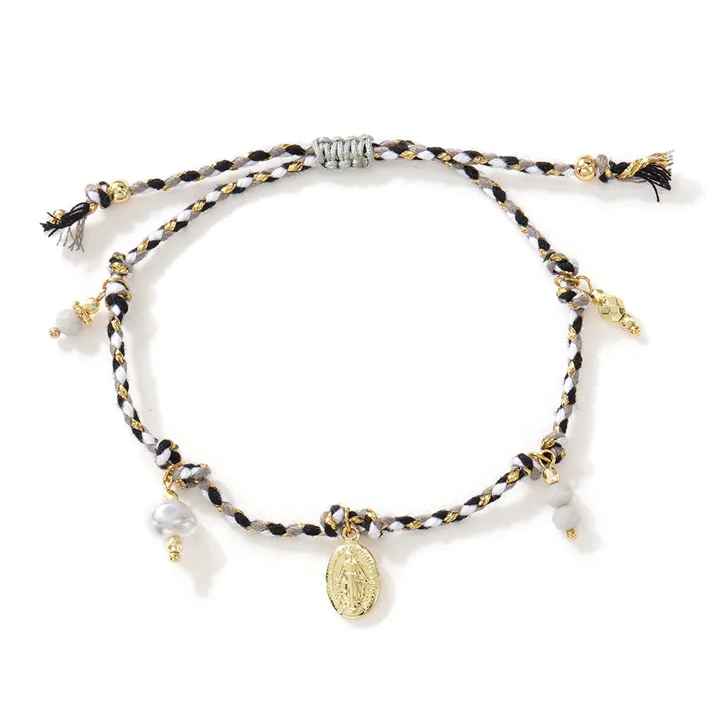 A colourful hand-woven braided rope bracelet for women in an ethnic strap tag style.