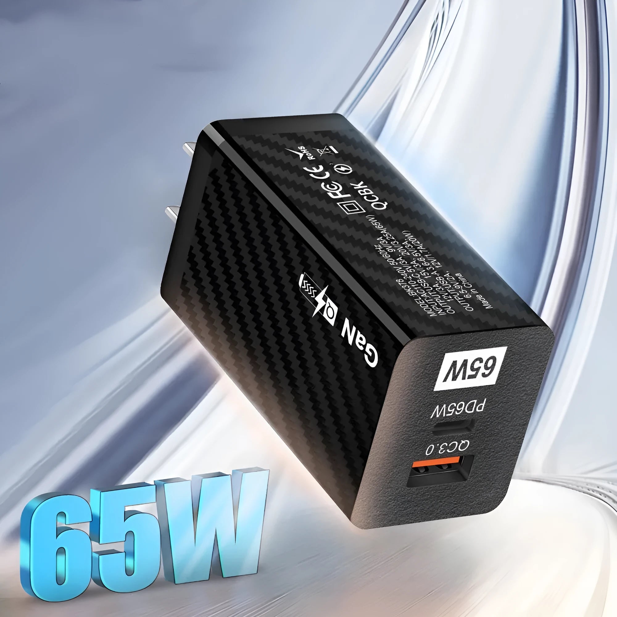 65W Gallium Nitride laptop charger in black with UK plug showing compact dimensions