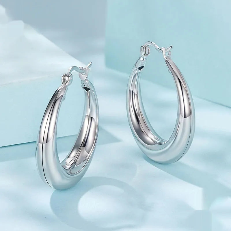Women's copper ring clip earrings with electroplating treatment in three size options