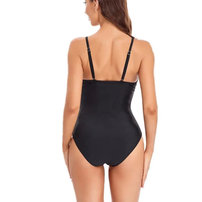Women's solid colour mesh one-piece swimsuit with backless design in black or blue options