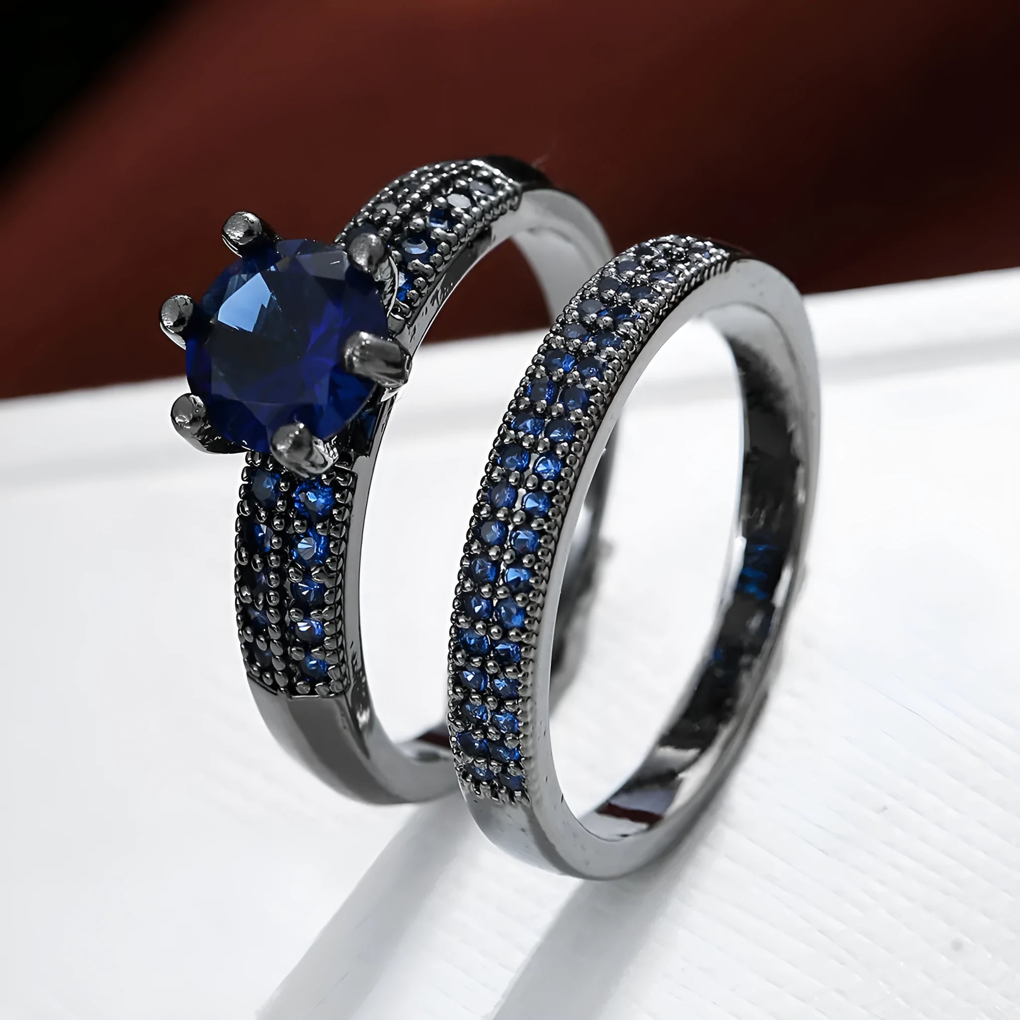 Copper hollow geometric fashion ring with zircon accents in multiple colour finishes on a size chart