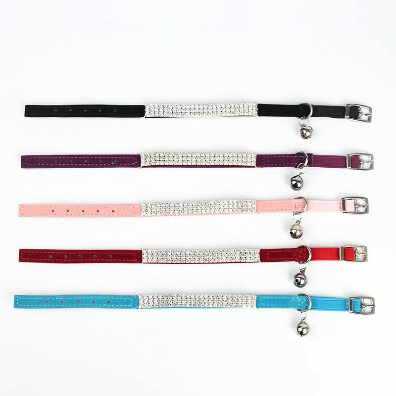 Velvet cat collar with rhinestones, shown in red colour, adjustable from 20 to 30 cm.