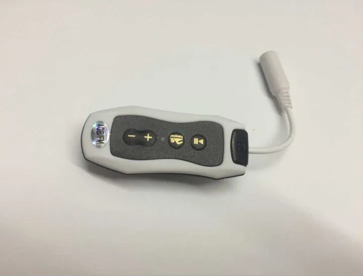 Compact black Bluetooth MP3 player with attached earphones, shown next to a USB cable.