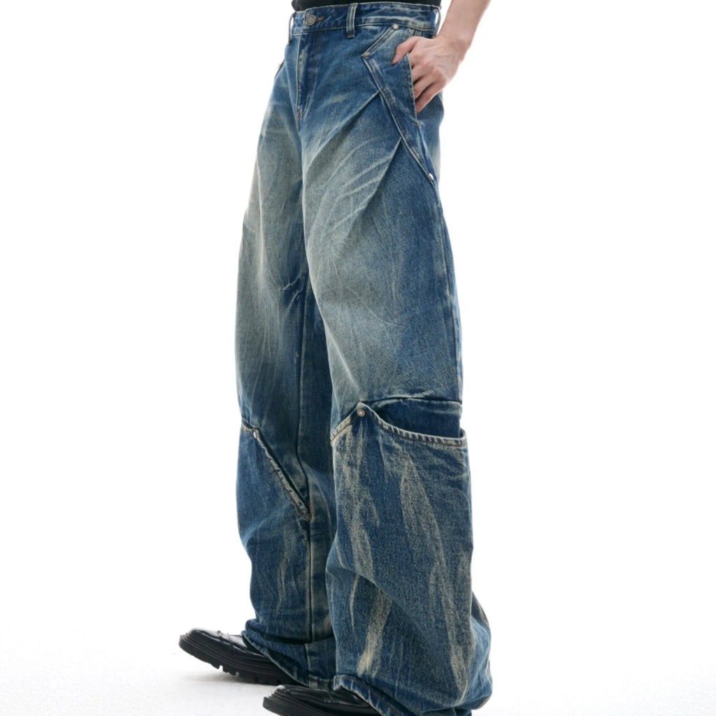 Men's retro washed burst pattern curved knife jeans in verdant blue colour showing loose fit design