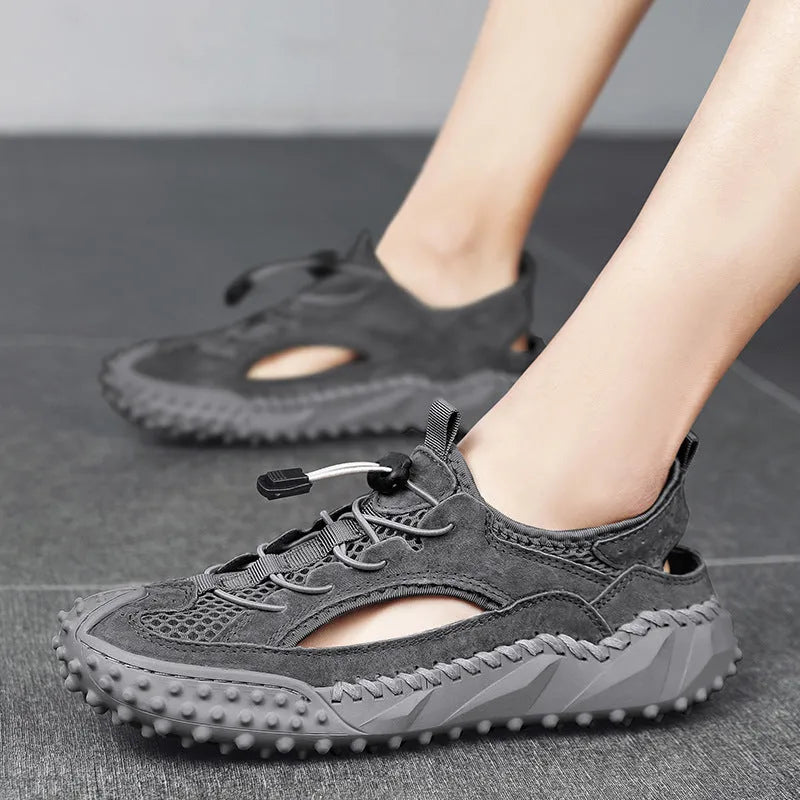Men's black hollow sports sandals with leather mesh upper, rubber sole, and elastic band closure