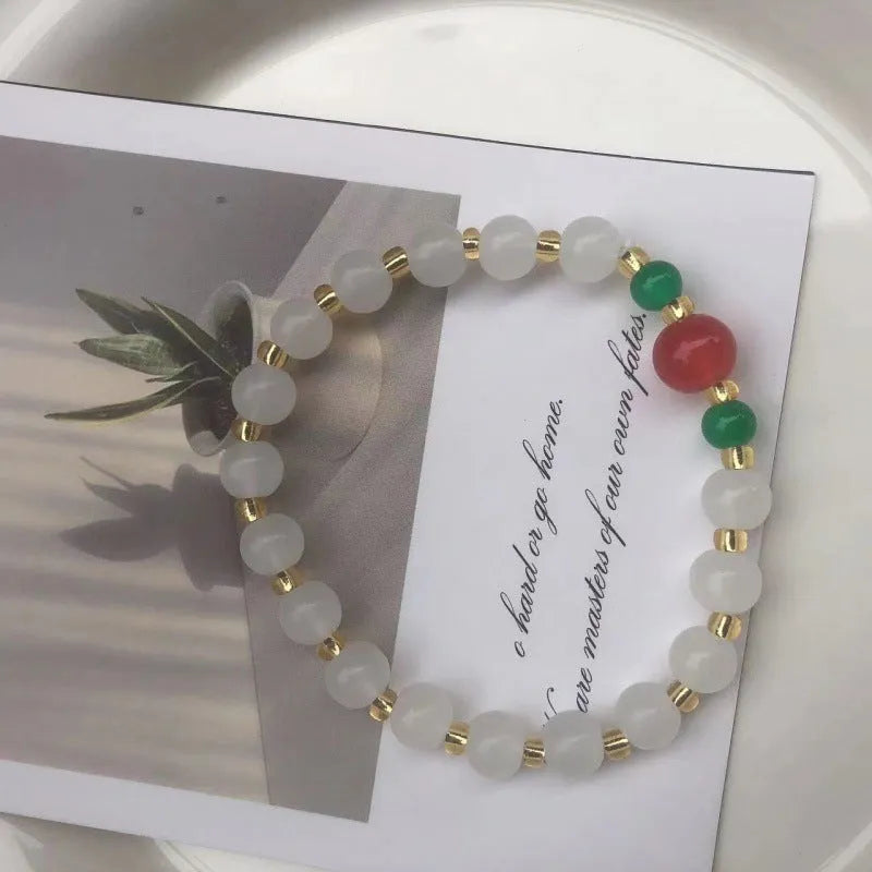 Handmade Chinese style glass bracelet with bamboo joint beads in a red Lvzhu Duobao design.