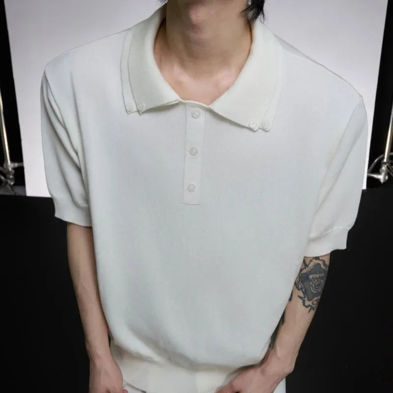 Man wearing a grey double collar knit short sleeve t-shirt.