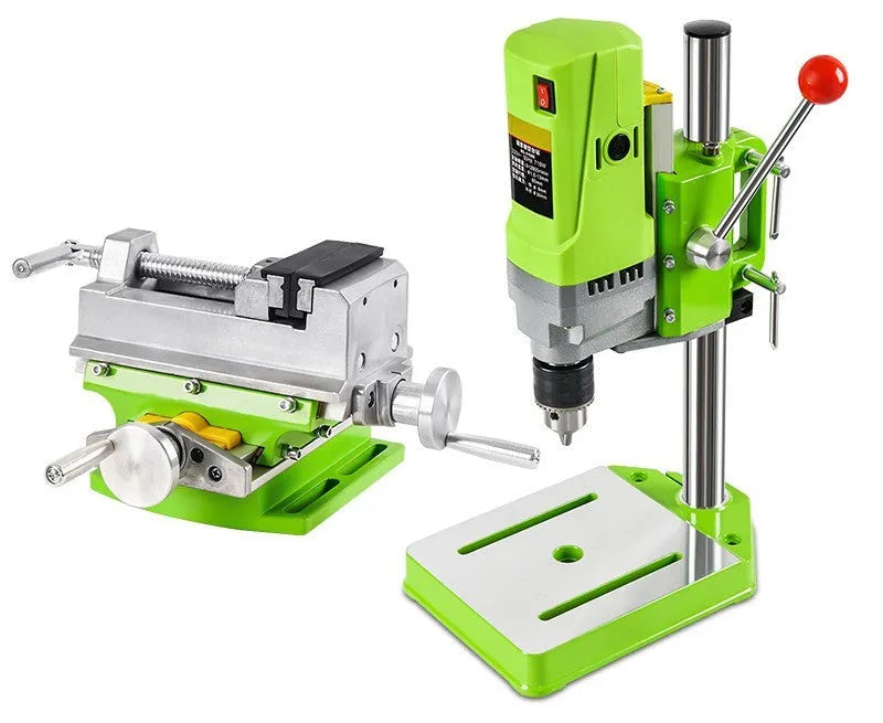 Bench drilling machine with cross bench pliers on workbench