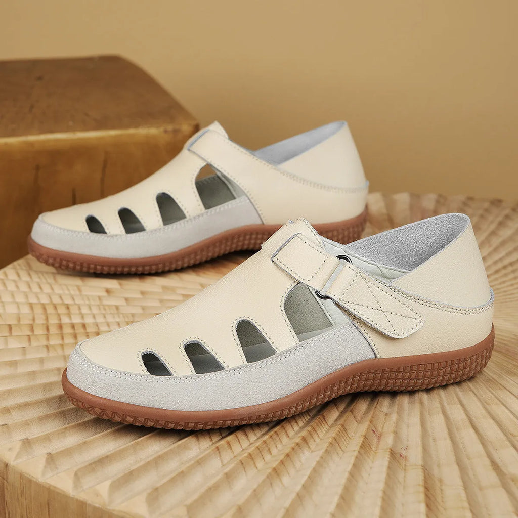 Plus size women's flat heel sandals with hollow toe cap in blue colour showing rubber sole
