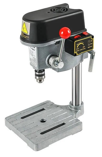 Bench drilling machine with cross bench pliers on workbench
