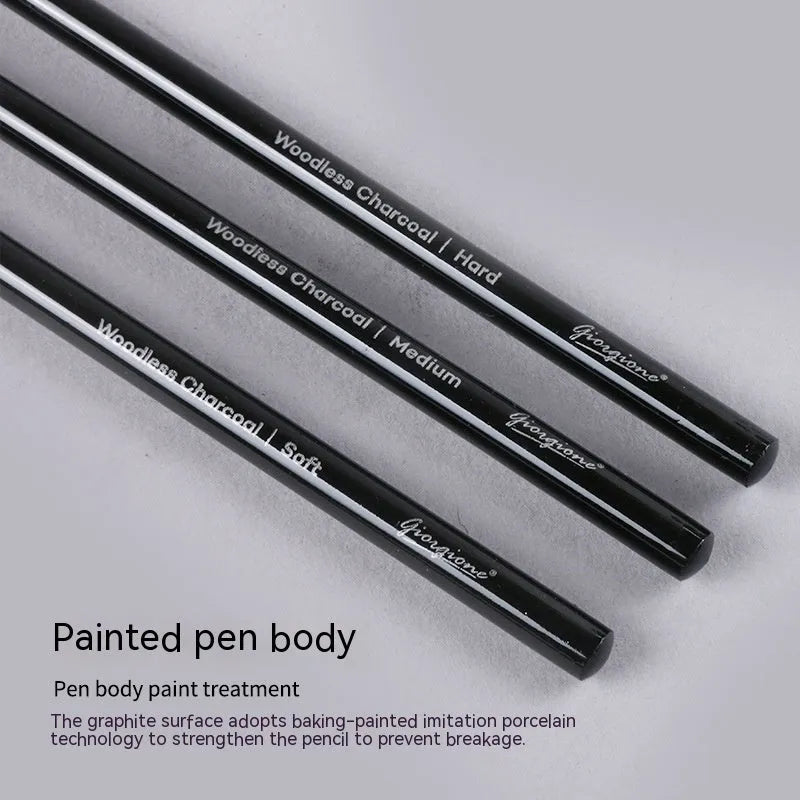 Graphite and carbonized drawing pencil set on a suction card, showing wooden-shell pencils.