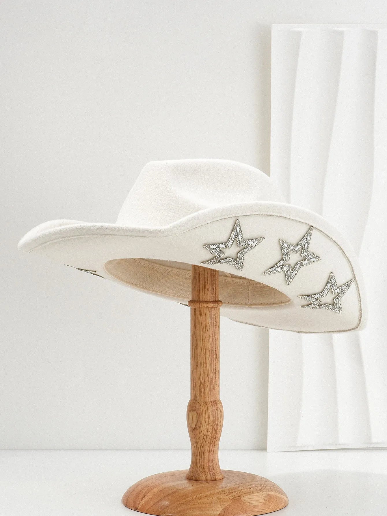 Beige polyester Western denim top hat with a conical crown and a hexagonal star decoration on the front.
